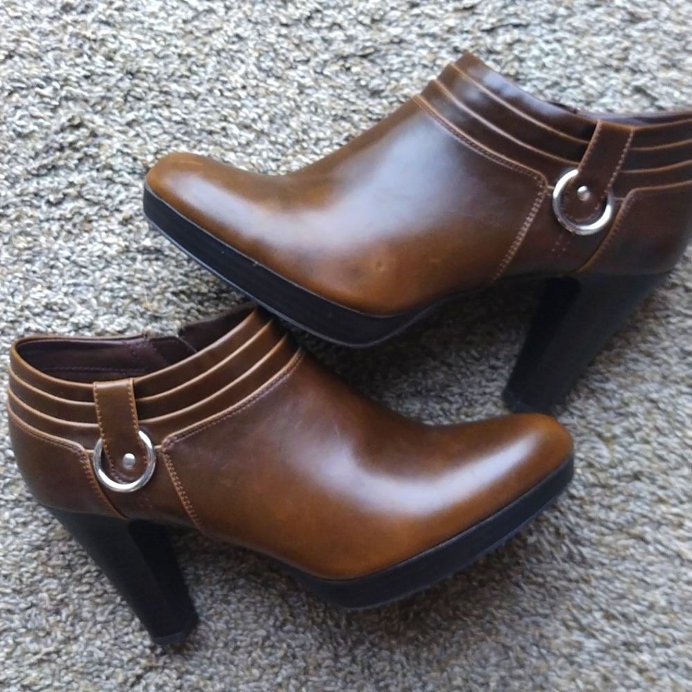 Brown leather low cut high heel boots.